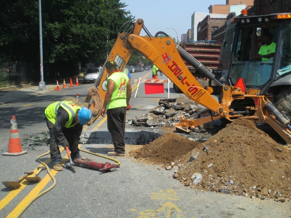 Roadway Sinkhole Caused by Broken Sewer Line - harriswatermain